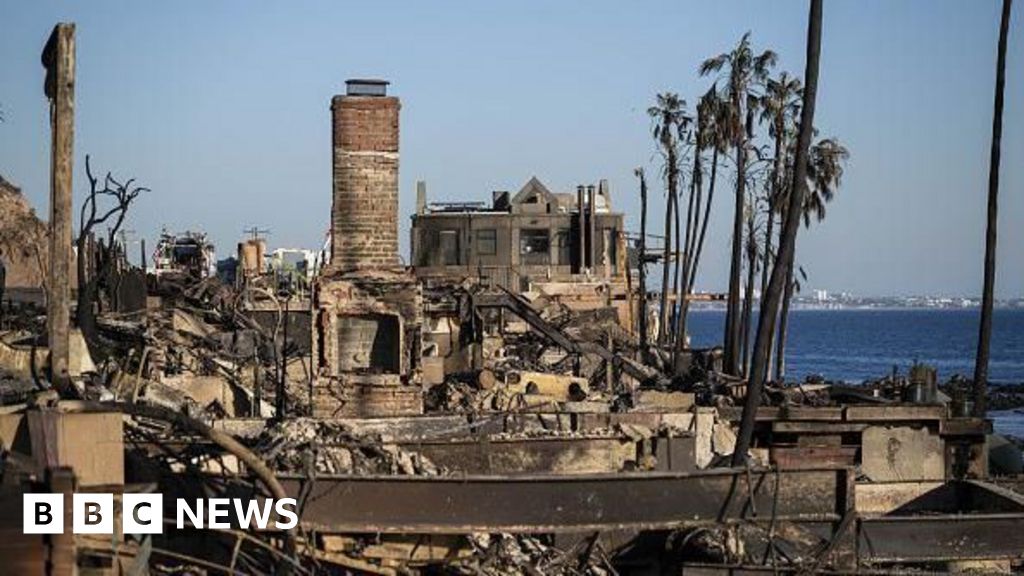 Los Angeles' strong winds ease, giving tired firefighters some respite
