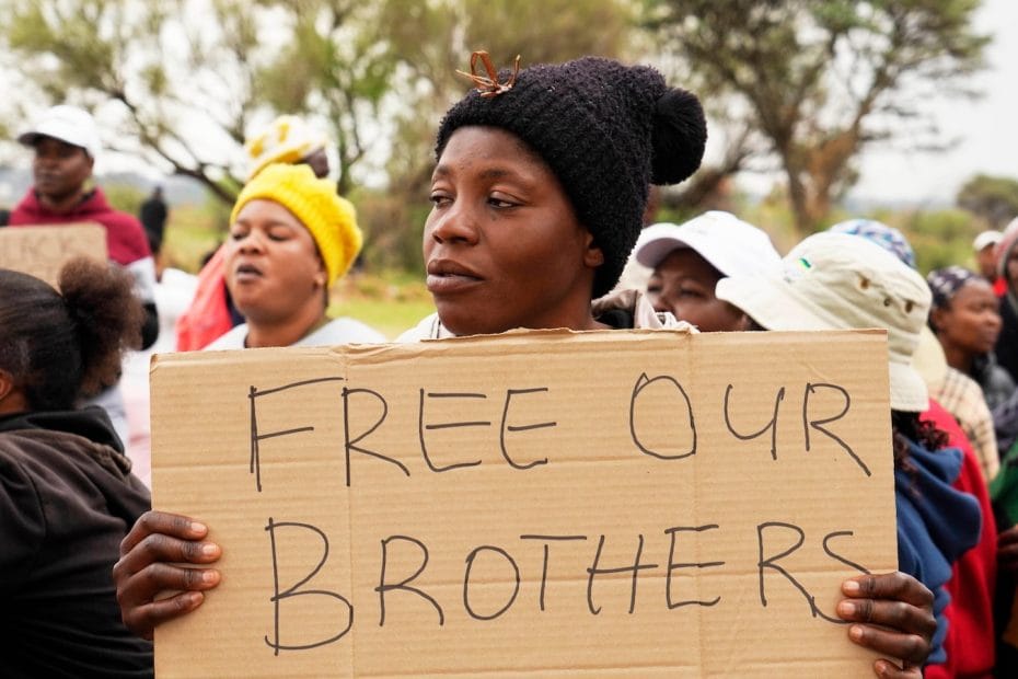 Rescuers try to pull survivors from hundreds of people trapped in a South African mine