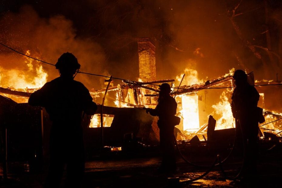 Residents outside town watch from afar as homes burn during Los Angeles fires