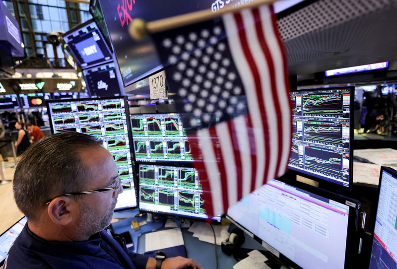 Stocks hover near new highs, oil prices fall