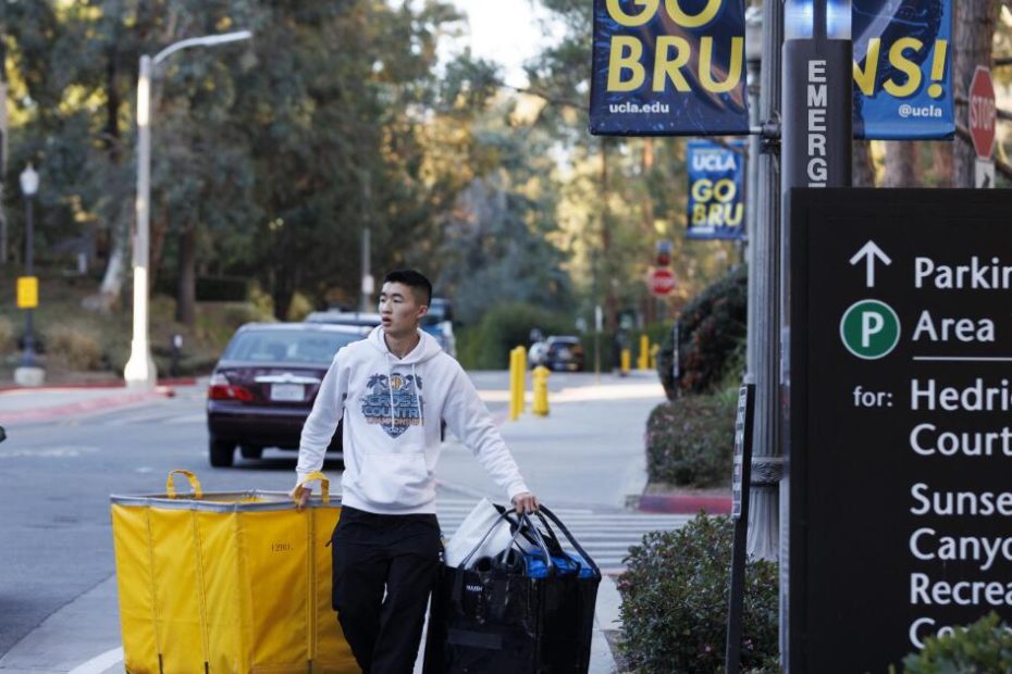 Students flee the Palisades fire evacuation zone next to the UCLA campus