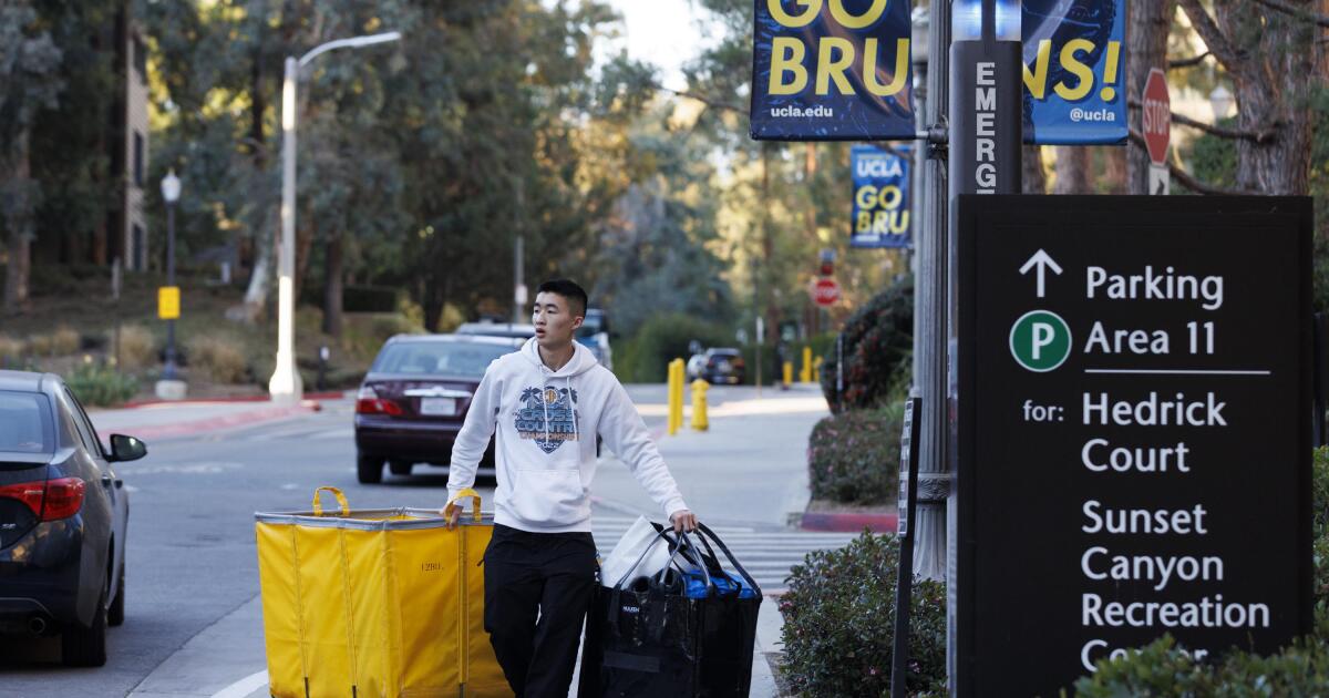 Students flee the Palisades fire evacuation zone next to the UCLA campus