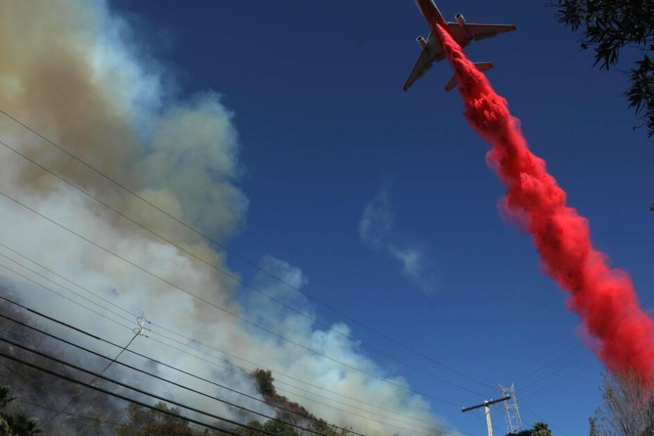 Through burning hills and blinding smoke: the air battle to save a city