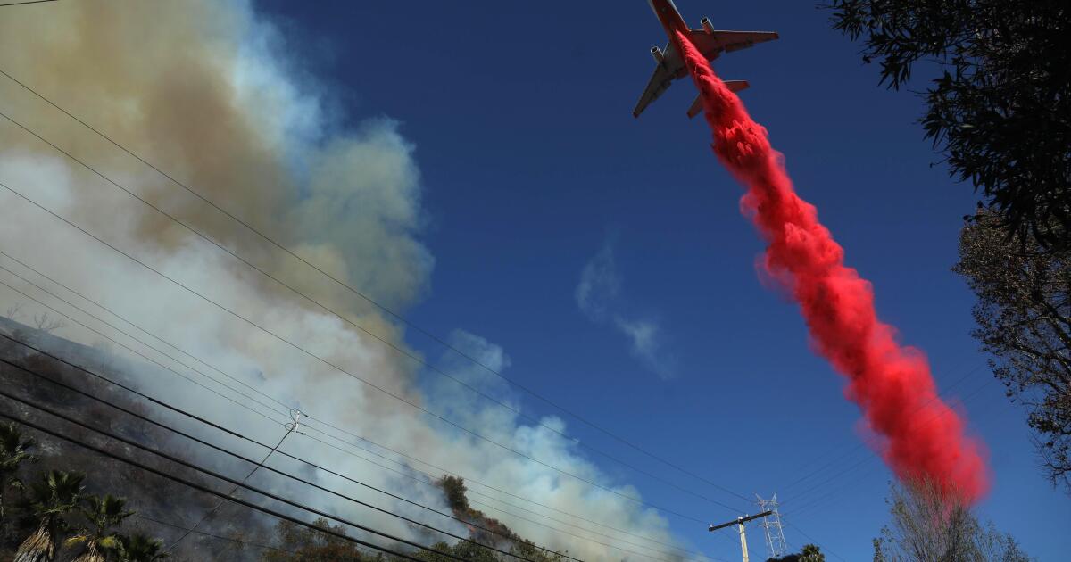 Through burning hills and blinding smoke: the air battle to save a city