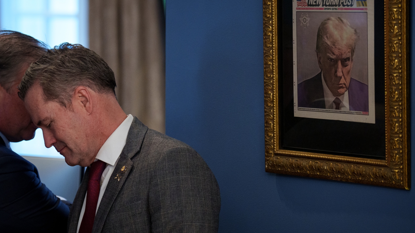 A golden Trump cup lens is hanging outside the Oval Office: NPR