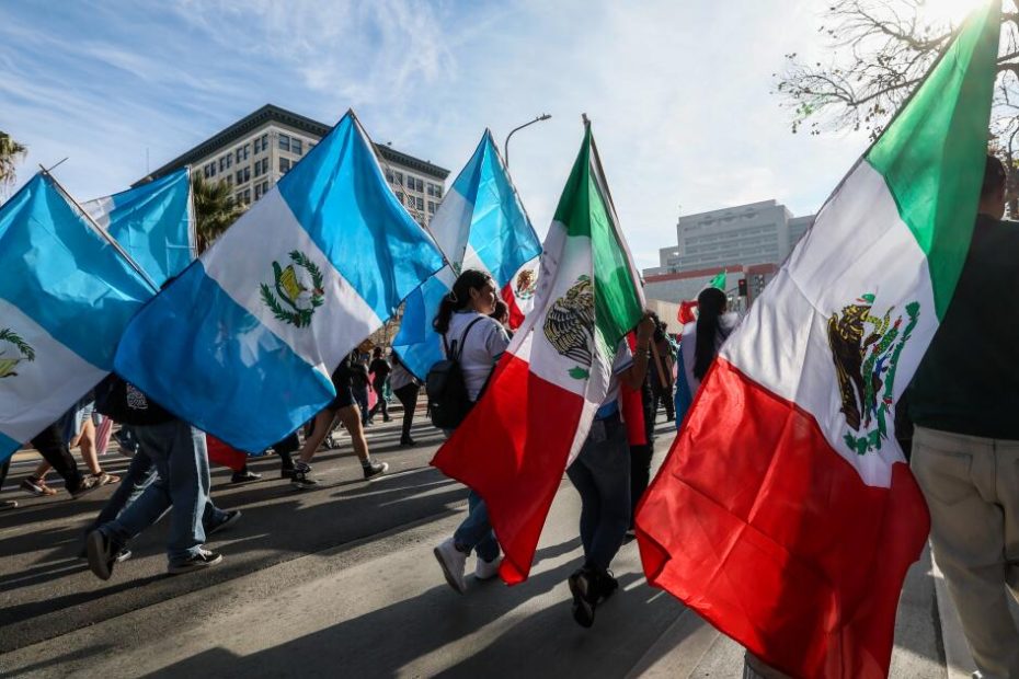 Why is the Mexican national flag waving at the immigration assembly?
