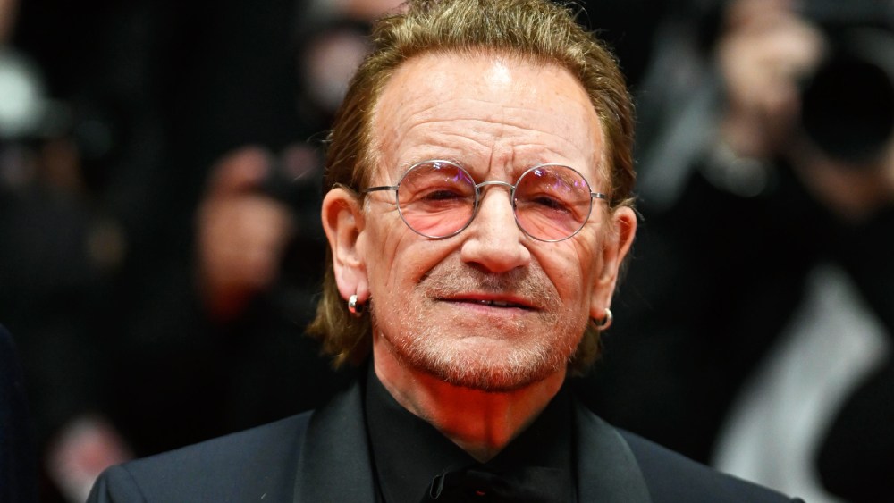 Bono received a 7-minute Cannes singing to express the “stories of surrender”