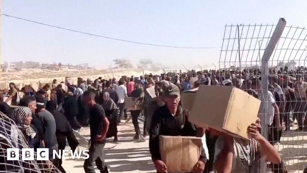 Crowd Storm US Support Group's New Aid Distribution Center