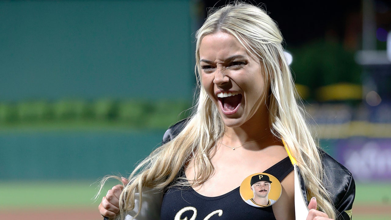 Livvy Dunne cheers on the first court of Si Models, Paul Skenes occupying the mound