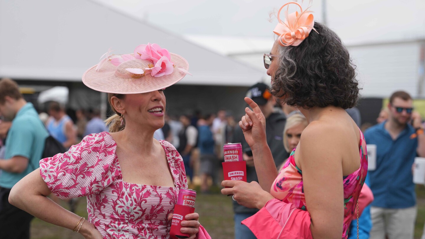 Preakness tradition: drinks, fashion, flowers, black-eyed Susan cocktails and blankets, trophy