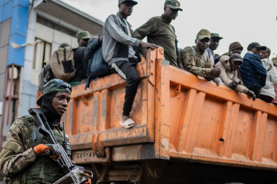 The Red Cross escorts hundreds of stranded Congolese soldiers from rebel-controlled cities to capital