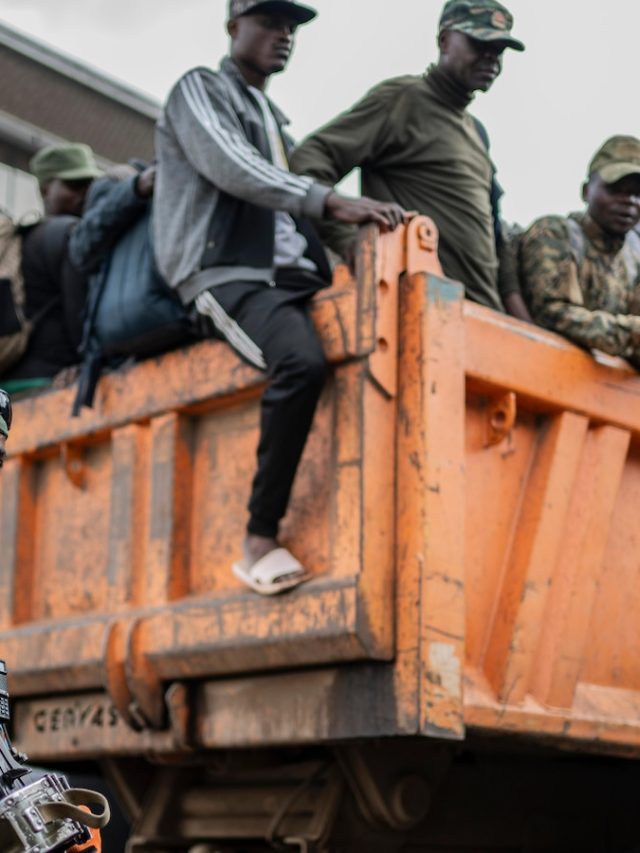 The Red Cross escorts over 1,000 disarmed Congolese soldiers from rebel-controlled cities to the capital
