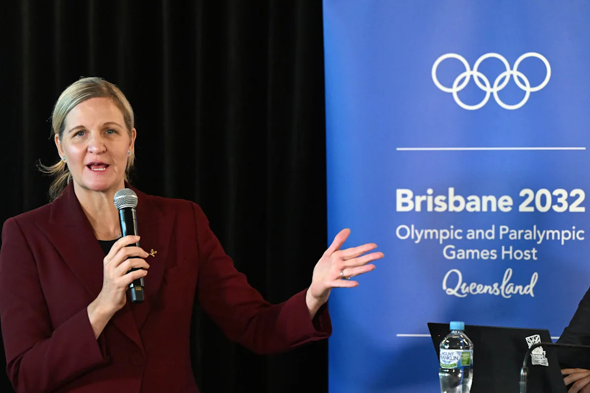 The baton in the hands of the upcoming IOC Head Coventry at the Brisbane 2032 Olympics