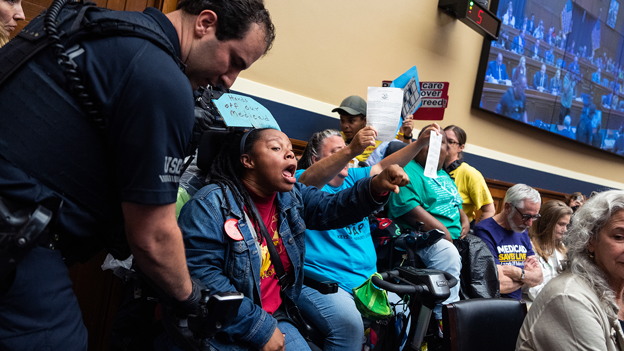 Watch: Cory Booker cheers protesters who interrupt the home budget mark hearing